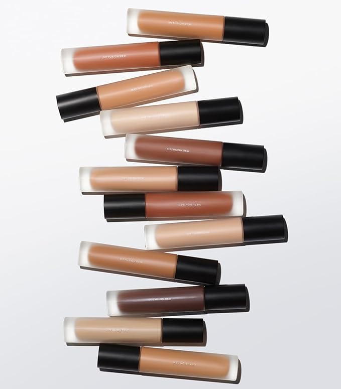 MAKE Beauty Diffusion Dew Skin Tint. Sheer to Medium Coverage Radiant Finish. Blurring, Smoothing, and Brightening for Glowing Complexion. Enhanced with Niacinamide and Adenosine. Suede 12